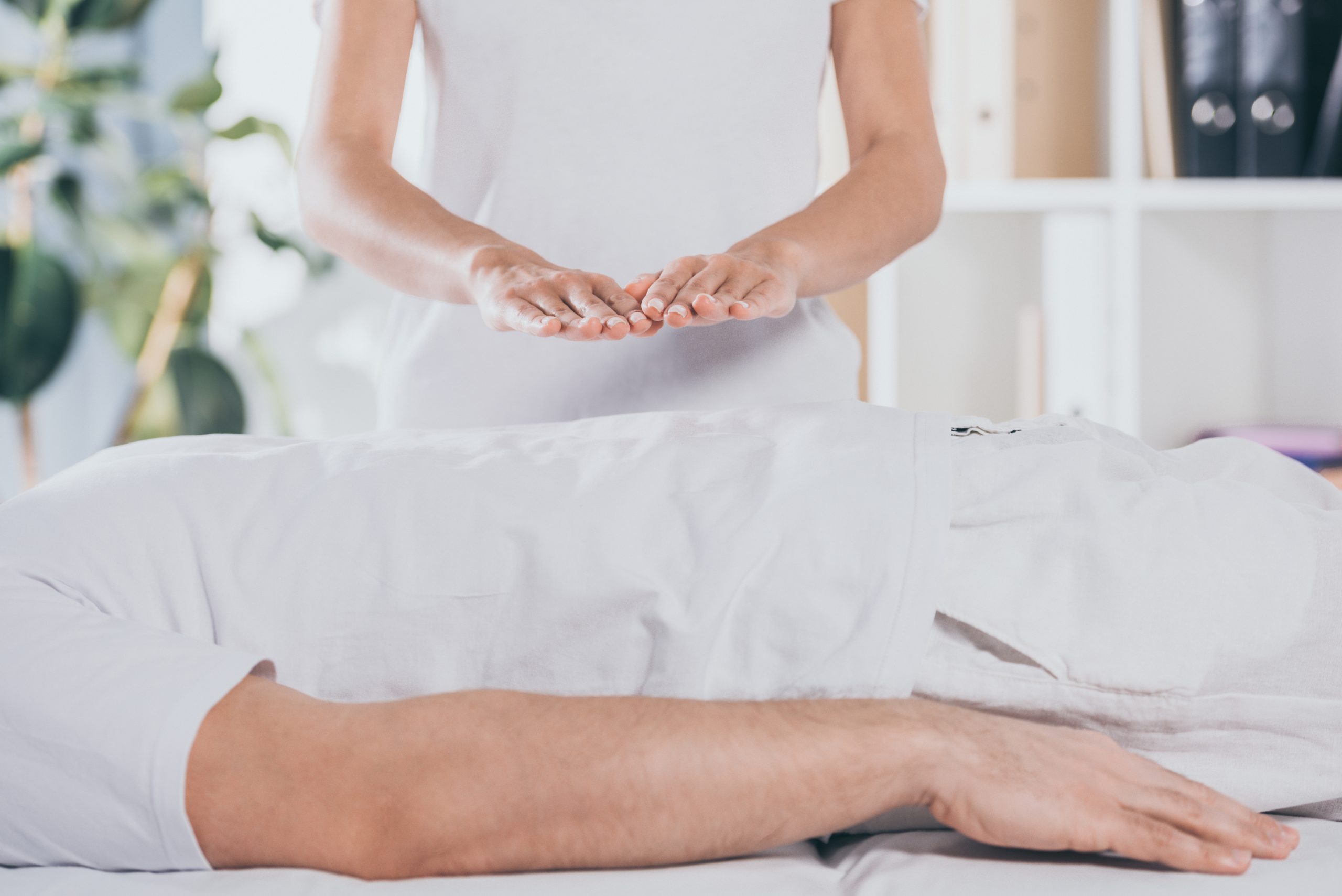 person receiving reiki healing therapy