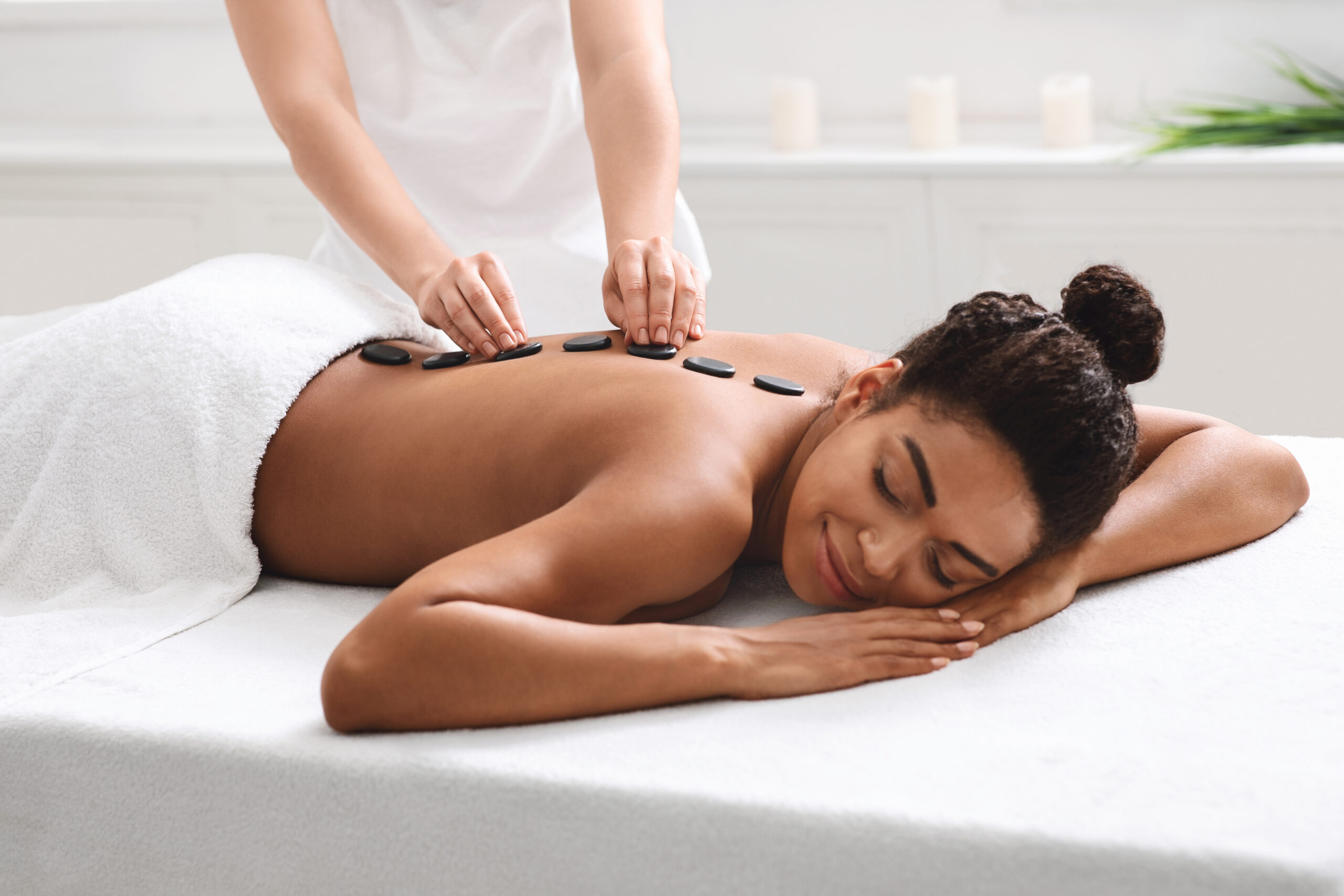 The benefits of hot stone massage therapy - Prana Endura